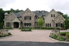 Paper / wire / scratch / brown / with an elastomeric acrylic finish coat.  EPS with an acrylic finish window trim and cornice.  Dimensional stone.  Wood brackets.